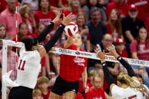 Nebraska alumnus Lauren Stivrins (26) spikes the ball against Nebraska Cornhuskers Teraya Sigler (11) and Andi Jackson (15) in the second set during the Nebraska alumni match on Saturday, Aug. 16, 2025 in Lincoln, Nebraska. Photo by John S. Peterson.
