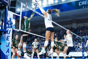 Ava Martin blocks the ball during the Creighton Volleyball Exhibition game vs Colorado State on August 16th, 2025 in Omaha, Nebraska. Photo by Drew Balus.