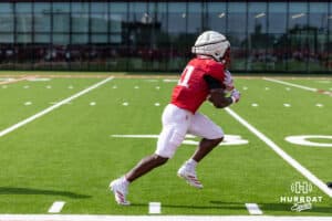 Nebraska Cornhusker Emmett Johnson (21) runs with the ball during football practice on Tuesday, Aug. 12, 2025 in Lincoln, Nebraska. Photo by John S. Peterson.