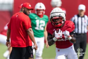 Nebraska Cornhusker Emmett Johnson (21) runs with the ball during football practice on Tuesday, Aug. 12, 2025 in Lincoln, Nebraska. Photo by John S. Peterson.