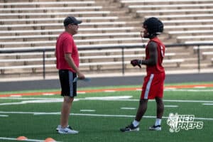 Tay Tay Jenkins talks with a coach during Westside football practice on Tuesday, August 12th, 2025 in Omaha Nebraska. Photo by Brandon Tiedemann.