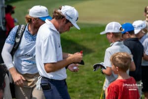 Quade Cummins signs a hat during The Pinnacle Bank Championship on August, 10th 2025 in Omaha Nebraska. Photo by Brandon Tiedemann.