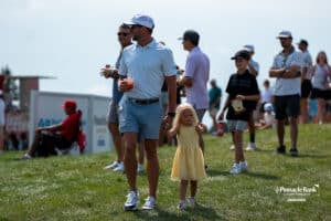 A father and daughter walk around during The Pinnacle Bank Championship on August, 10th 2025 in Omaha Nebraska. Photo by Brandon Tiedemann.