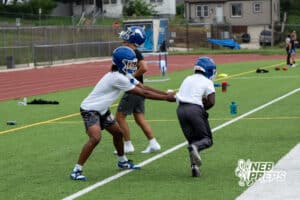 Elijah Cannon hands the ball off during Omaha North football practice on August 11th, 2025 in Omaha Nebraska. Photo by Brandon Tiedemann.