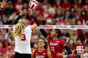 Nebraska Cornhusker Taylor Landfair (12) spikes the ball against Allie Sczech in the third set during the Red/White Scrimmage on Saturday, Aug. 9, 2025 in Lincoln, Nebraska. Photo by John S. Peterson.
