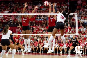 Nebraska Cornhusker Ryan Hunter (18) spikes the ball against Manaia Ogbechie and Virginia Adriano in the third set during the Red/White Scrimmage on Saturday, Aug. 9, 2025 in Lincoln, Nebraska. Photo by John S. Peterson.