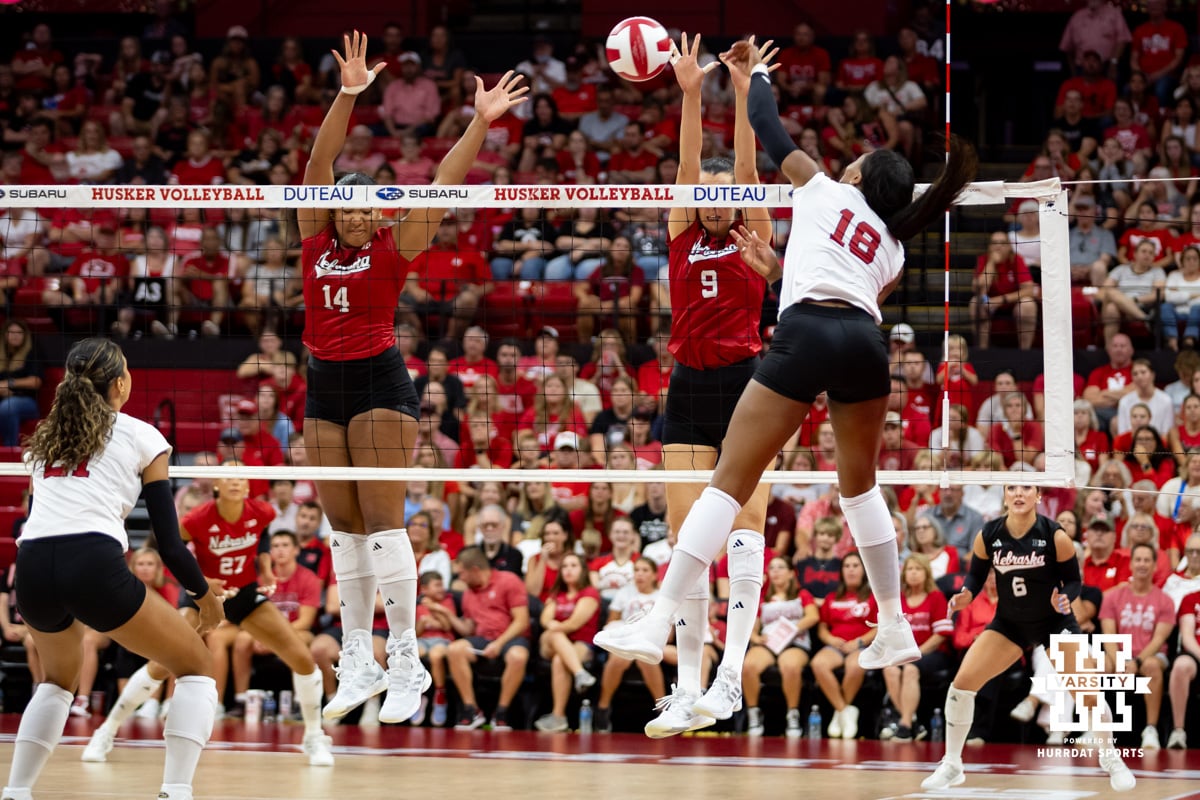 Nebraska Cornhusker Ryan Hunter (18) spikes the ball against Manaia Ogbechie and Virginia Adriano in the third set during the Red/White Scrimmage on Saturday, Aug. 9, 2025 in Lincoln, Nebraska. Photo by John S. Peterson.