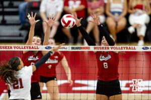 Nebraska Cornhusker Kenna Cogill (8) and Virginia Adriano jump to block the ball against Skyler Pierce in the second set during the Red/White Scrimmage on Saturday, Aug. 9, 2025 in Lincoln, Nebraska. Photo by John S. Peterson.