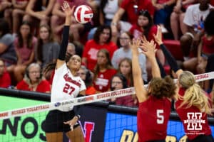 Nebraska Cornhusker Harper Murray (27) spikes the ball against Rebekah Allick (5) and Allie Sczech (3) during the Red/White Scrimmage on Saturday, Aug. 9, 2025 in Lincoln, Nebraska. Photo by John S. Peterson.