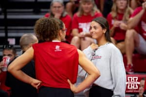 Former Nebraska Cornhusker Merritt Beason talks to Rebekah Allick (5) before the Red/White Scrimmage on Saturday, Aug. 9, 2025 in Lincoln, Nebraska. Photo by John S. Peterson.