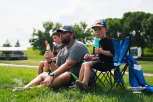 Spectators eating popsicles during the Pinnacle Bank Championship, Saturday, August 9th, 2025, in Omaha, Nebraska. Photo by Nick Barajas.