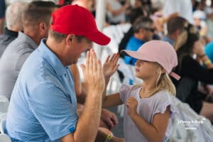 Spectators high five during the Pinnacle Bank Championship, Saturday, August 9th, 2025, in Omaha, Nebraska. Photo by Nick Barajas.