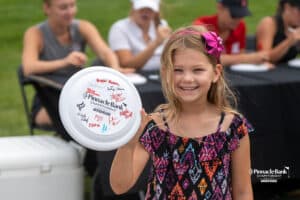 Fan smiles with autographs during The Pinnacle Bank Championship on August 9th, 2025, in Omaha, Nebraska. Photo by Brandon Tiedemann.