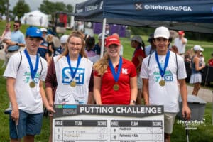 Olivia Lovegrove smiles with the winning group during The Pinnacle Bank Championship on August 9th, 2025, in Omaha, Nebraska. Photo by Brandon Tiedemann.