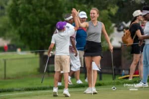 Katie Ruge high-fives teammate during The Pinnacle Bank Championship on August 9th, 2025, in Omaha, Nebraska. Photo by Brandon Tiedemann.