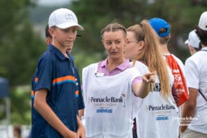 Caddie talking with golfers during The Pinnacle Bank Championship on August 9th, 2025, in Omaha, Nebraska. Photo by Brandon Tiedemann.