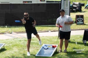 Fans play corn hole during The Pinnacle Bank Championship on August 8th, 2025, in Omaha, Nebraska. Photo by Brandon Tiedemann.