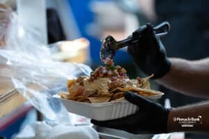Nachos being made during The Pinnacle Bank Championship on August 8th, 2025, in Omaha, Nebraska. Photo by Brandon Tiedemann.