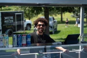 Mouth of the South worker smiles during The Pinnacle Bank Championship on August 8th, 2025, in Omaha, Nebraska. Photo by Brandon Tiedemann.