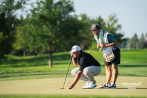 Luke Gutschewski reading the green with his caddy during the Pinnacle Bank Championship, Friday, August 8th, 2025, in Omaha, Nebraska. Photo by Nick Barajas.
