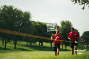 Event staff head to the next hole during the Pinnacle Bank Championship golf tournament Thursday, August 7th, 2025, in Omaha, Nebraska. Photo by Nick Barajas.