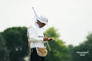 Alvaro Ortiz's caddy makes notes during the Pinnacle Bank Championship golf tournament Thursday, August 7th, 2025, in Omaha, Nebraska. Photo by Nick Barajas.