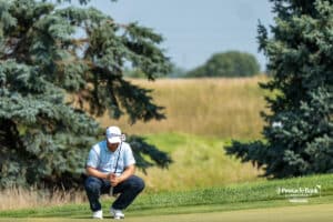 A golfer preparing to putt during The Pinnacle Bank Championship on August, 7th, 2025 in Omaha Nebraska. Photo by Brandon Tiedemann.