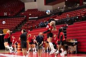 Laney Choboy serves during Nebraska volleyball practice. Photo by Brandon Tiedemann.