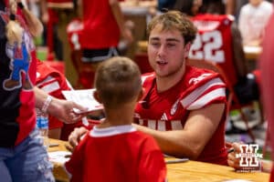 Nebraska Cornhusker Tristan Alvano (30) talks with a young fan during Nebraska’s football Fan Day on Saturday, Aug. 2, 2025 in Lincoln, Nebraska. Photo by John S. Peterson.