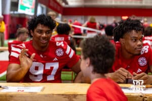 Nebraska Cornhusker Keona Davis (97) talks to a young fan during Nebraska’s football Fan Day on Saturday, Aug. 2, 2025 in Lincoln, Nebraska. Photo by John S. Peterson.