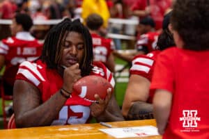Nebraska Cornhusker Gabe Moore (95) signs an autograph during Nebraska’s football Fan Day on Saturday, Aug. 2, 2025 in Lincoln, Nebraska. Photo by John S. Peterson.