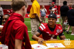 Nebraska Cornhusker Malcolm Hartzog Jr. (7) signs a autograph for a fan during Nebraska’s football Fan Day on Saturday, Aug. 2, 2025 in Lincoln, Nebraska. Photo by John S. Peterson.