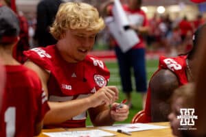 Nebraska Cornhusker Maverick Noonan (22) signs an autograph during Nebraska’s football Fan Day on Saturday, Aug. 2, 2025 in Lincoln, Nebraska. Photo by John S. Peterson.