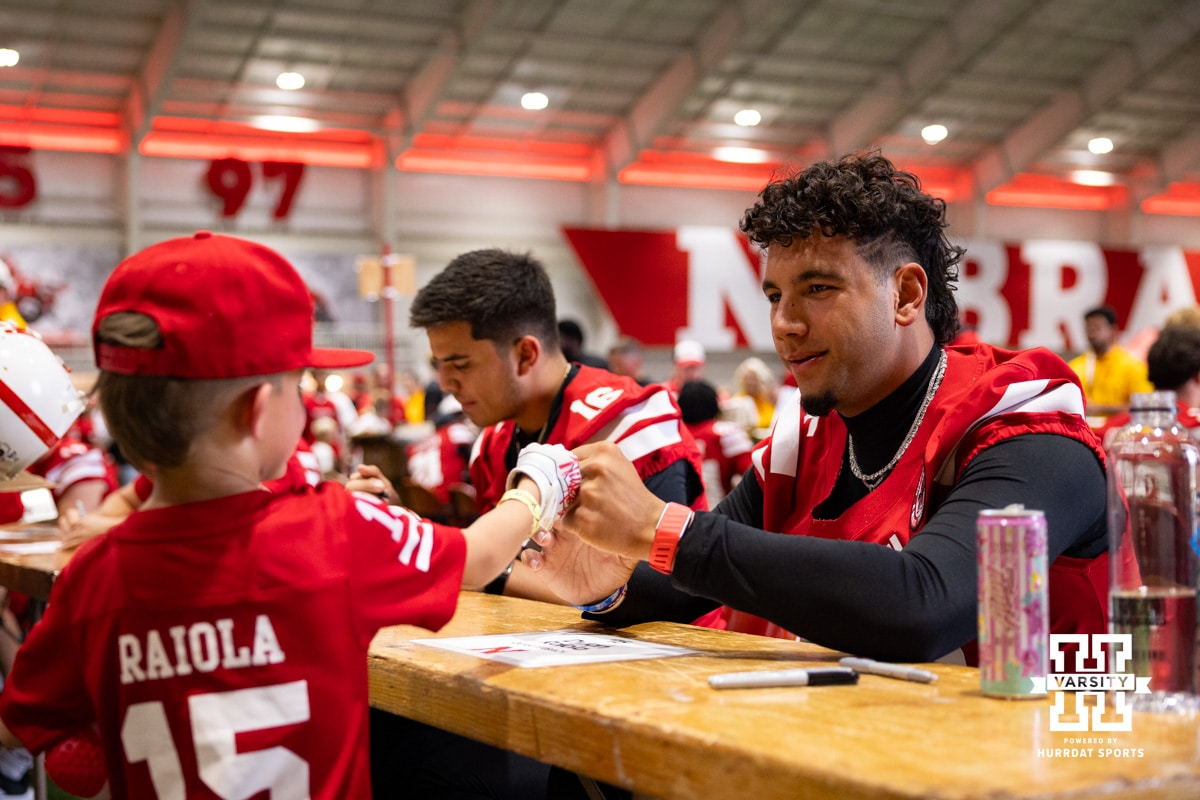 Nebraska Cornhusker Dylan Raiola (15) gvies a young fan a fist bump during Nebraska’s football Fan Day on Saturday, Aug. 2, 2025 in Lincoln, Nebraska. Photo by John S. Peterson.