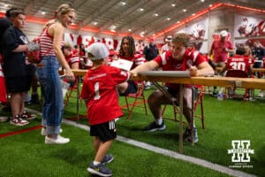Nebraska Cornhusker Luke Longval (17) gives a fist bump to a young fan during Nebraska’s football Fan Day on Saturday, Aug. 2, 2025 in Lincoln, Nebraska. Photo by John S. Peterson.