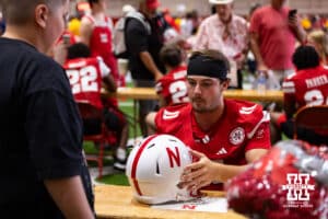 Nebraska Cornhusker Bode Soukup (11) signs an autograph for a fan during Nebraska’s football Fan Day on Saturday, Aug. 2, 2025 in Lincoln, Nebraska. Photo by John S. Peterson.
