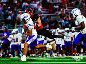 Omaha Centrals Yasir Grixby (2) brushing off a defender to get extra yards during a high school football game @ Westside on Friday, September 26 2025 in Omaha, Nebraska. Photo By Jack R. Stephens