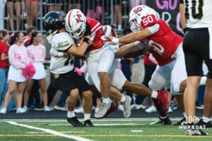 Urban Kennedy makes a backfield tackle during the Millard South football game vs Lincoln Southeast on September 25th, 2025 in Omaha, Nebraska. Photo by Drew Balus.