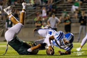 Bennington quarterback Ty Buaphakeo (12) rolls over the goal line with a Gretna Defender during a High School Football game, Friday, September 26th, 2025, Gretna, Nebraska. Photo by Braden Cochran.
