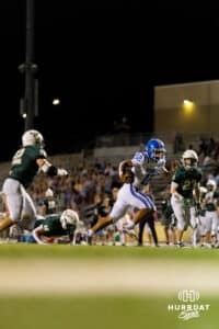 Badger quarterback Ty Buaphakeo (12) moves past Gretna defenders for the endzone during a High School Football game, Friday, September 26th, 2025, Gretna, Nebraska. Photo by Braden Cochran.
