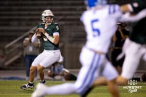 Gretna quarterback Michael Knudsen (5) looks for a target downfield during a High School Football game, Friday, September 26th, 2025, Gretna, Nebraska. Photo by Braden Cochran.