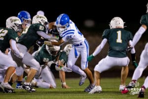 Badger running back Knox Naughton attempts to break through a group of Gretna defenders during a High School Football game on Friday, September 26, 2025, in Gretna, Nebraska. Photo by Braden Cochran.