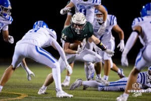 Gretna running back Ayden Furstenau (24) tries to evade a swarm of Bennington defenders during a High School Football game, Friday, September 26th, 2025, Gretna, Nebraska. Photo by Braden Cochran.