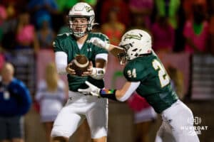 Gretna quarterback Micheal Knudsen (5) hands the ball off to running back Ayden Furstenau (24) during a High School Football game, Friday, September 26th, 2025, Gretna, Nebraska. Photo by Braden Cochran.