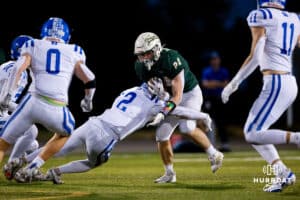 Bennington defender Myles Gifford makes a tackle on Gretna's Austin Furtaneu (24) during a High School Football game, Friday, September 26th, 2025, Gretna, Nebraska. Photo by Braden Cochran.