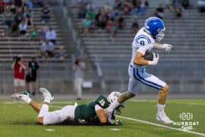 Bennington wide receiver Jake Russel steps out of a Gretna defender's grip on his way to the endzone during a High School Football game, Friday, September 26th, 2025, Gretna, Nebraska. Photo by Braden Cochran.