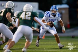 Bennington quarterback Ty Buaphapeko (12) scrambles out of the pocket to avoid Gretna defenders during a High School Football game, Friday, September 26th, 2025, Gretna, Nebraska. Photo by Braden Cochran.