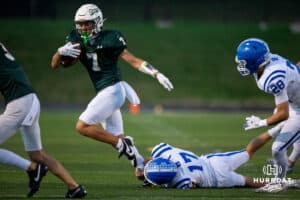Gretna Dragon Joe Sullivan (7) makes his way past a fallen Bennington defender during a High School Football game, Friday, September 26th, 2025, Gretna, Nebraska. Photo by Braden Cochran.
