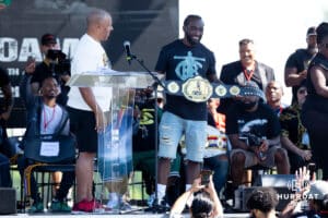 Bud Crawford is handed a belt by Omaha Mayor John W Ewig Jr during the Terence "Bud" Crawford World Champion Victory Parade, Saturday, September 27, 2025, Omaha, Nebraska. Photo by Braden Cochran.