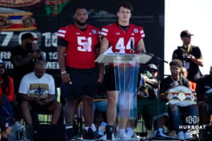 Husker Football players Jusin Evans (51) and Luke Lindenmeyer (44) talk at the podium during the Terence "Bud" Crawford World Champion Victory Parade, Saturday, September 27, 2025, Omaha, Nebraska. Photo by Braden Cochran.